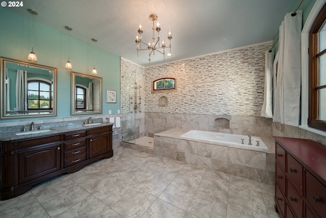 26480 SW Wilken Ln, West Linn, OR 97068 - full bath featuring tile walls, a garden tub, double vanity, a chandelier, and a tile shower