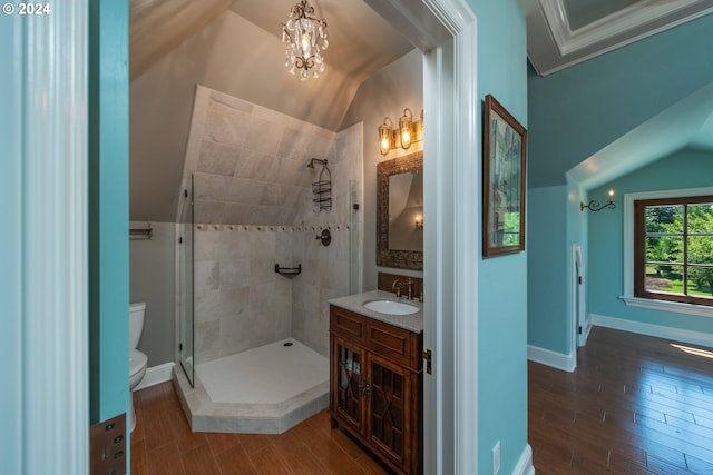 26480 SW Wilken Ln, West Linn, OR 97068 - full bath featuring toilet, vanity, wood finished floors, tiled shower, and a chandelier
