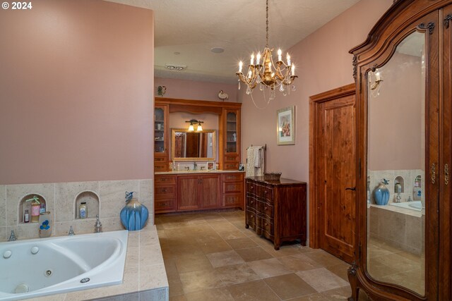 26480 SW Wilken Ln, West Linn, OR 97068 - full bathroom featuring vanity, a jetted tub, a chandelier, and tile patterned floors