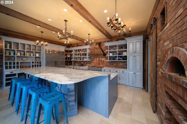 26480 SW Wilken Ln, West Linn, OR 97068 - kitchen with a chandelier, built in refrigerator, custom range hood, open shelves, and gas range oven