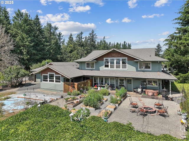 back of house featuring a fire pit and a patio area