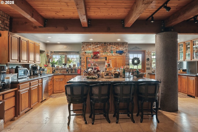 kitchen featuring beamed ceiling, wooden ceiling, and appliances with stainless steel finishes