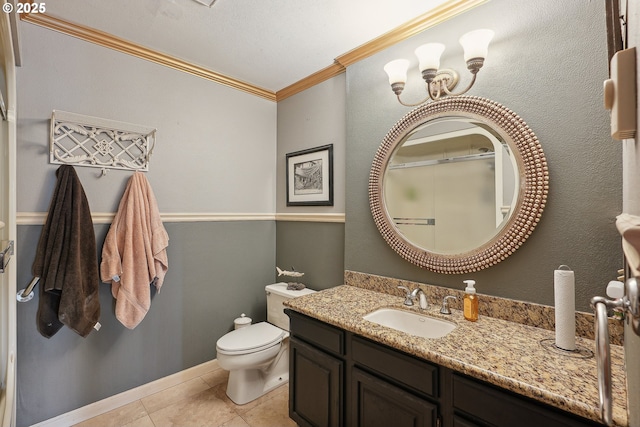 bathroom with vanity, a shower with door, tile patterned floors, crown molding, and toilet