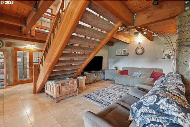 living room featuring french doors, beamed ceiling, wooden ceiling, and light tile patterned floors