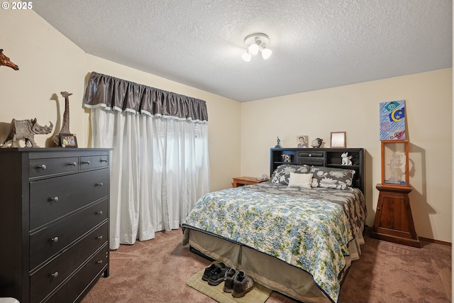 bedroom with carpet flooring and a textured ceiling