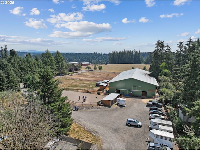 birds eye view of property with a rural view