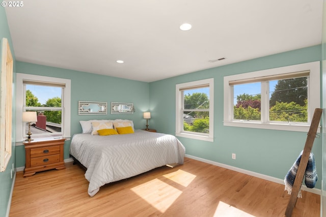 224 NE 44th Ave, Portland, OR 97213 - bedroom featuring light wood-style flooring, multiple windows, baseboards, and recessed lighting