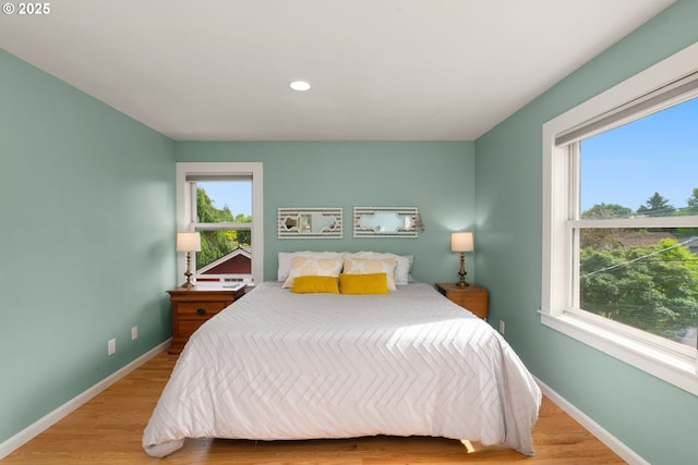 224 NE 44th Ave, Portland, OR 97213 - bedroom with baseboards, wood finished floors, and recessed lighting