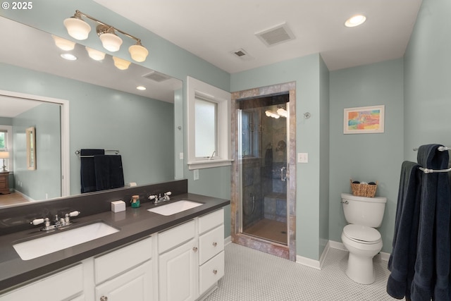 224 NE 44th Ave, Portland, OR 97213 - full bathroom featuring double vanity, toilet, a stall shower, tile patterned floors, and recessed lighting