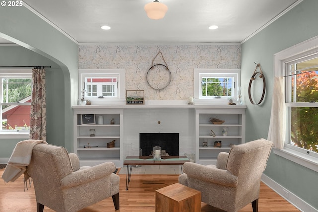224 NE 44th Ave, Portland, OR 97213 - living area with wood finished floors, ornamental molding, plenty of natural light, and baseboards