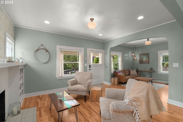 224 NE 44th Ave, Portland, OR 97213 - living room featuring arched walkways, crown molding, baseboards, plenty of natural light, and recessed lighting