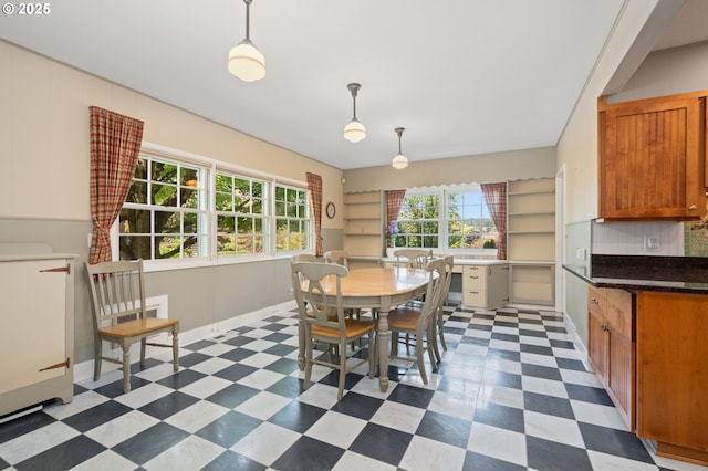 dining area featuring dark floors