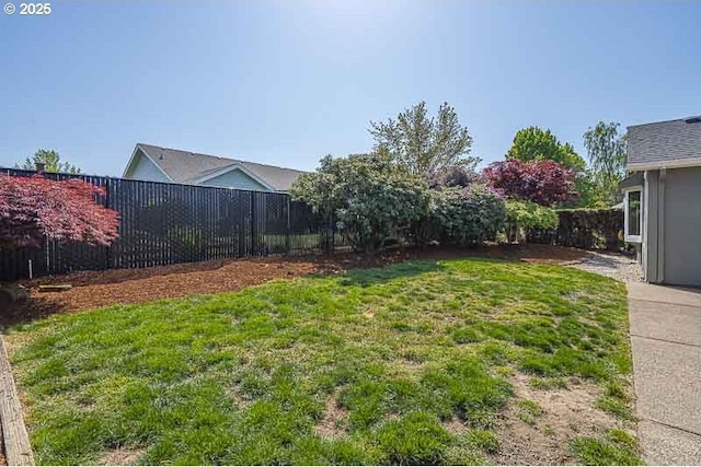 view of yard with a fenced backyard