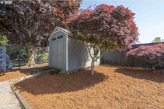 view of shed featuring a fenced backyard