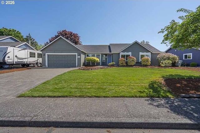 ranch-style house featuring decorative driveway, a front yard, and a garage