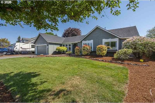 ranch-style home with a garage and a front lawn
