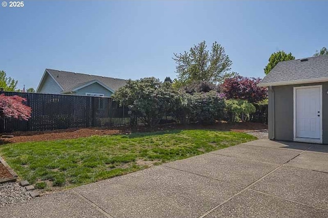 view of yard featuring a patio and fence
