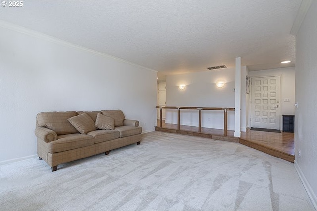living area featuring baseboards, visible vents, light carpet, and ornamental molding