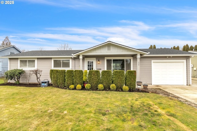 single story home featuring an attached garage, driveway, board and batten siding, and a front yard