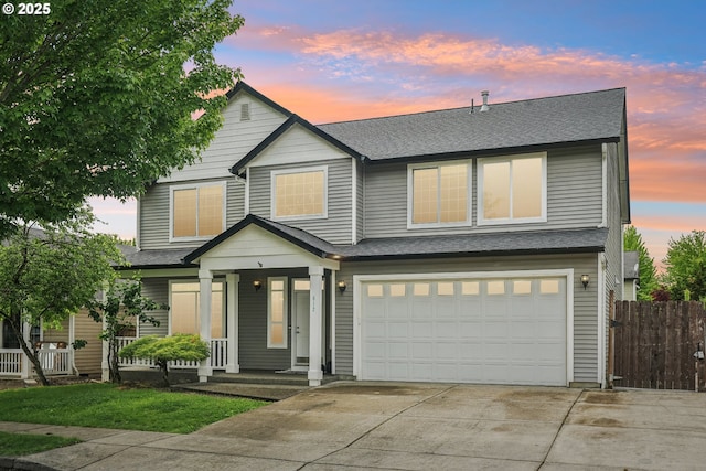 812 NW 13th Ave, Battle Ground, WA 98604 - townhome / multi-family property with a porch, driveway, an attached garage, and roof with shingles