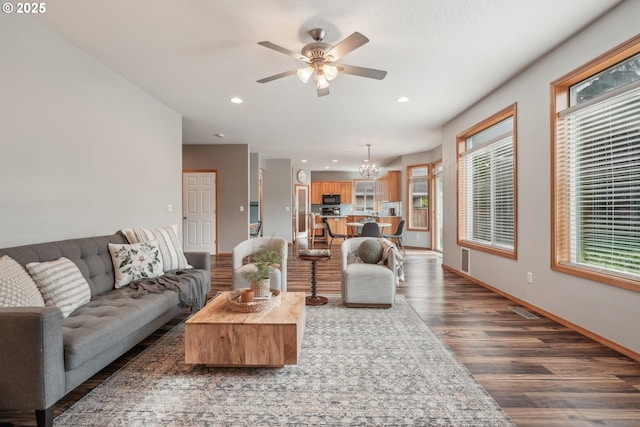 812 NW 13th Ave, Battle Ground, WA 98604 - living room with wood finished floors, a ceiling fan, recessed lighting, a chandelier, and baseboards