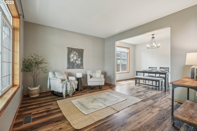 812 NW 13th Ave, Battle Ground, WA 98604 - sitting room with wood finished floors, a chandelier, and baseboards