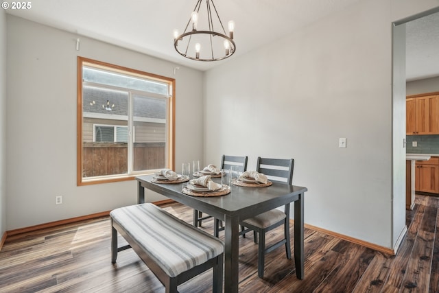 812 NW 13th Ave, Battle Ground, WA 98604 - dining space featuring a chandelier, baseboards, and dark wood-style flooring
