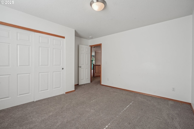 812 NW 13th Ave, Battle Ground, WA 98604 - unfurnished bedroom featuring carpet flooring, a closet, and baseboards