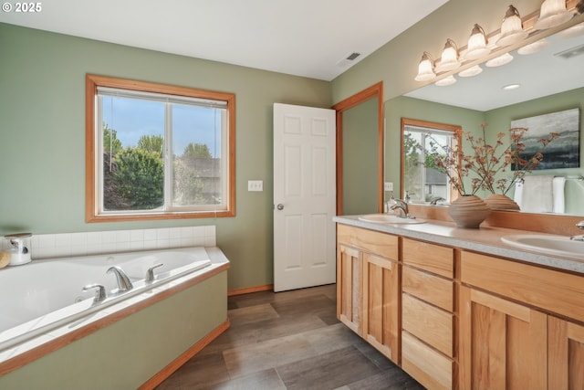 812 NW 13th Ave, Battle Ground, WA 98604 - bathroom with double vanity, a bath, and baseboards