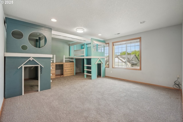 812 NW 13th Ave, Battle Ground, WA 98604 - unfurnished living room with carpet, recessed lighting, baseboards, and a textured ceiling