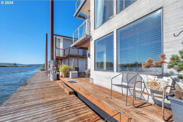 dock area with a deck with water view