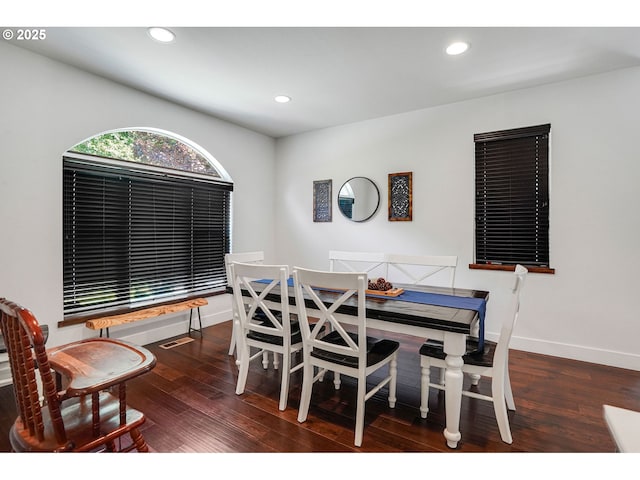 dining area featuring baseboards, recessed lighting, and wood finished floors
