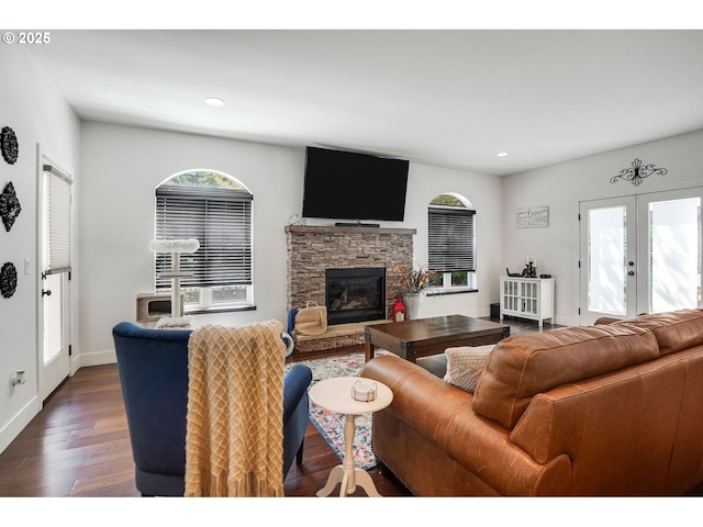 living area with recessed lighting, plenty of natural light, and dark wood-style flooring