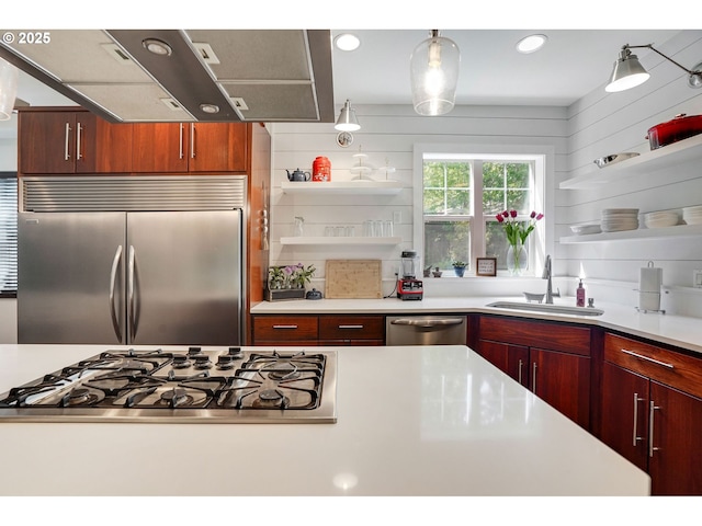 kitchen with light countertops, open shelves, a sink, and stainless steel appliances
