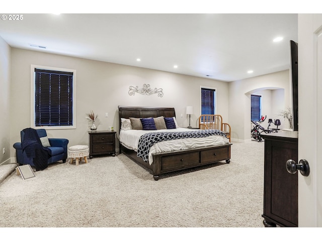 carpeted bedroom with baseboards, recessed lighting, and visible vents
