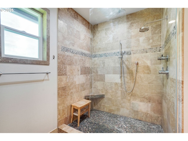 bathroom with tiled shower