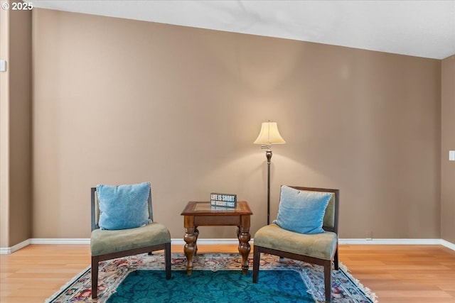 living area with hardwood / wood-style flooring