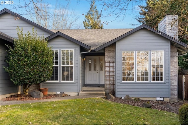 view of front of property with a front lawn