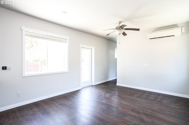 116 W J St, Springfield, OR 97477 - unfurnished room featuring a wall unit AC, healthy amount of natural light, ceiling fan, and dark wood-style floors