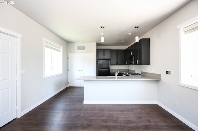 116 W J St, Springfield, OR 97477 - kitchen with black appliances, a peninsula, light countertops, and pendant lighting