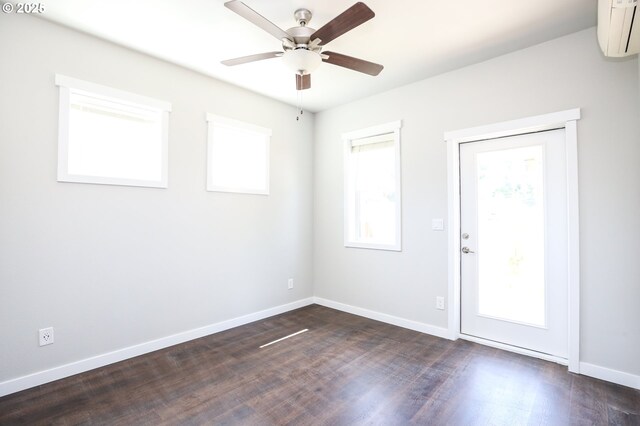 116 W J St, Springfield, OR 97477 - empty room with a wall unit AC, a ceiling fan, and dark wood-type flooring