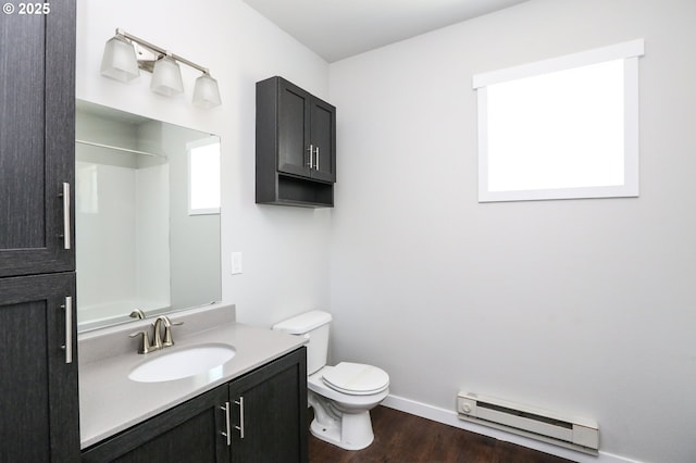 116 W J St, Springfield, OR 97477 - bathroom with baseboard heating, vanity, wood finished floors, and a shower