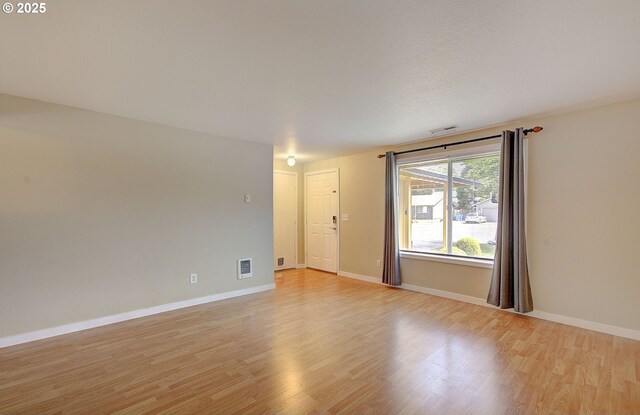 10808 NE 92nd Cir, Vancouver, WA 98662 - empty room with light wood-style floors and baseboards