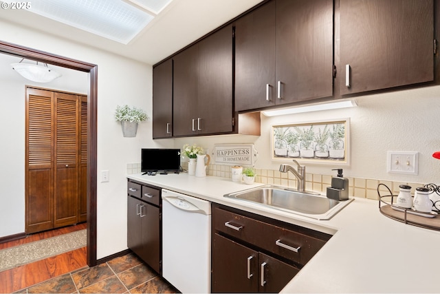 14935 NE Sacramento St Unit 28, Portland, OR 97230 - kitchen featuring white dishwasher, light countertops, and dark brown cabinetry