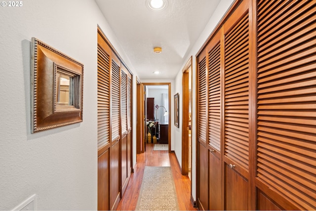 14935 NE Sacramento St Unit 28, Portland, OR 97230 - corridor with light wood-style flooring and recessed lighting