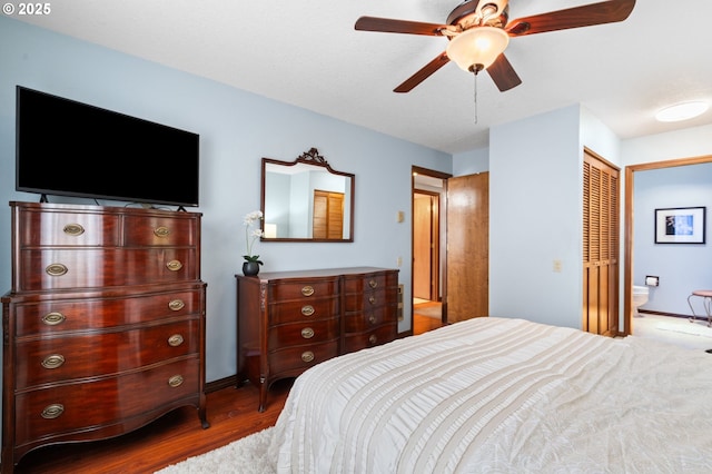 14935 NE Sacramento St Unit 28, Portland, OR 97230 - bedroom with wood finished floors, ceiling fan, and ensuite bathroom