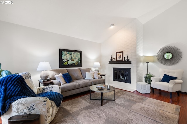 14935 NE Sacramento St Unit 28, Portland, OR 97230 - living room featuring vaulted ceiling, wood finished floors, and a brick fireplace