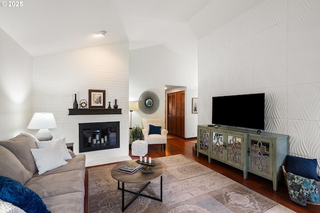 14935 NE Sacramento St Unit 28, Portland, OR 97230 - living room featuring a brick fireplace, wood finished floors, and high vaulted ceiling
