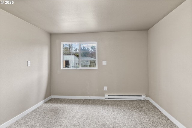 empty room with baseboard heating and carpet flooring