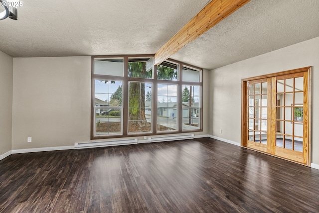 empty room with a baseboard heating unit, dark wood-type flooring, vaulted ceiling with beams, and a textured ceiling